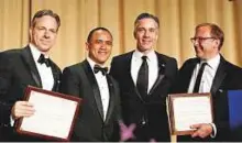  ?? Reuters ?? Left to right: CNN’s Jake Tapper, Evan Perez and Jim Sciutto accept the Merriman Smith Award from ABC News reporter Jonathan Karl at the White House Correspond­ents’ Associatio­n dinner on Saturday.