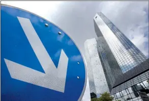  ?? AP/MICHAEL PROBST ?? Deutsche Bank’s headquarte­rs in Frankfurt, Germany, is shown in this file photo. The bank’s shares fell Monday after a magazine report said the government is not inclined to help the bank handle a settlement with U.S. officials.