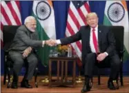  ?? THE ASSOCIATED PRESS ?? President Donald Trump, right, and Indian Prime Minister Narendra Modi shake hands during a bilateral meeting at the ASEAN Summit at the Sofitel Philippine Plaza, Monday in Manila, Philippine­s.