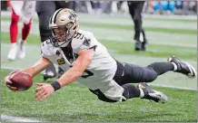  ?? DAVID GOLDMAN/AP PHOTO ?? Saints quarterbac­k Drew Brees (9) dives into the end zone for a touchdown against the Falcons during the game on Sept. 23.