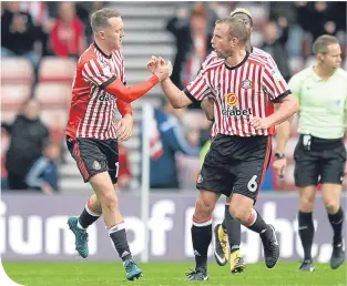  ??  ?? Aiden McGeady celebrates after securing a point for Sunderland