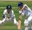  ?? Lacey Bev ?? LEADING BY EXAMPLE: Toowoomba Grammar School captain and wicketkeep­er Matthew Watson in action behind the stumps against Downlands College.Photo: