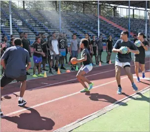  ?? Picture: REINAL CHAND ?? Natabua High School athletes warm up at Churchill Park in Lautoka.