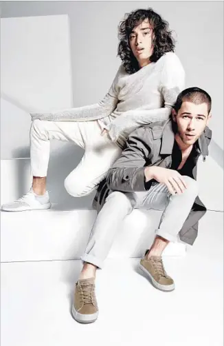  ?? Yu Tsai ?? NICK JONAS, right, and L.A.’s Creative Recreation have collaborat­ed on 1410, a sneaker line that the singer and first-time footwear designer created with “all different kinds of people” in mind.