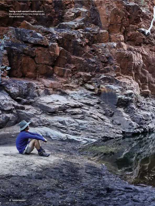  ??  ?? Taking a well-earned break to absorb the scenery of Serpentine Gorge on day three of the trek.