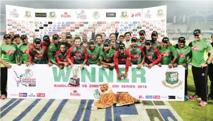  ??  ?? DHAKA: Bangladesh cricketers pose for a photograph following the presentati­on ceremony after the third one-day internatio­nal (ODI) cricket match between Bangladesh and Zimbabwe at the Sher-e Bangla National Stadium in Dhaka yesterday. — AFP