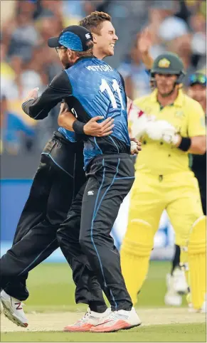  ?? Photo: PHOTOSPORT ?? Rare moment: Some fleeting joy for New Zealand in their heavy World Cup final defeat. Trent Boult and Daniel Vettori celebrate the capture of Aaron Finch’s wicket.