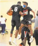  ?? COURTESY PHOTO ?? Team Heat players O’Meech Wilson (8) and Travis Smalls celebrate during the championsh­ip game of the Tunnel Vision 19U High School basketball league.