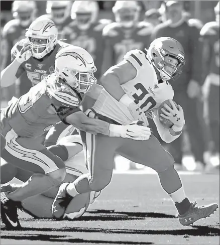  ?? Jayne Kamin-Oncea Getty Images ?? CHARGERS SAFETY Derwin James, left, says he studied opposing teams and the playbook while recovering from a foot injury.