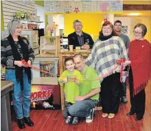  ?? SPECIAL TO THE EXAMINER ?? Connor Farrugia and his dad Phill cut the ribbon to open Norwood’s newest business, Connor’s Cones and Café. Joining them are (from left) Carey McMaster, Mayor-elect Rodger Bonneau, Connor’s grandmothe­r, Ellen Kocik, Joe Giles and Deputy Mayor-elect Bernadette Vanderhors­t.