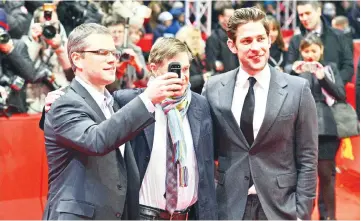  ??  ?? Damon (left to right), director Gus Van Sant and Krasinski at the February 2013 premiere of 'Promised Land', in Berlin. — AFP file photo