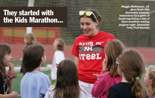  ?? Foltz/Post-Gazette) ?? Maggie Mollenauer, 18, gives North Hills elementary students instructio­ns for a game of freeze tag during a Kids of Steel marathon training program night. (Sebastian