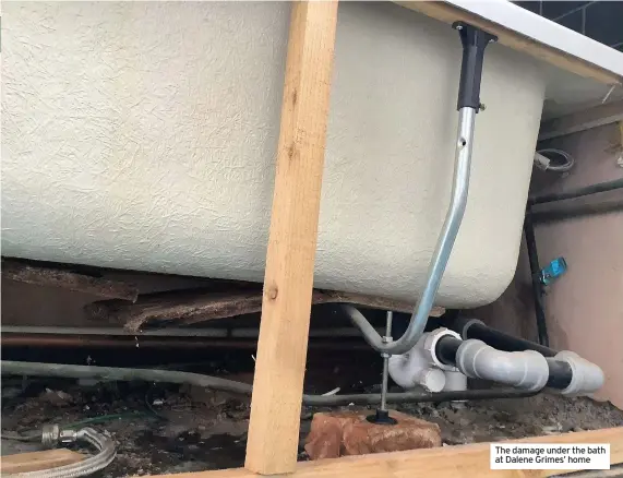  ??  ?? The damage under the bath at Dalene Grimes’ home