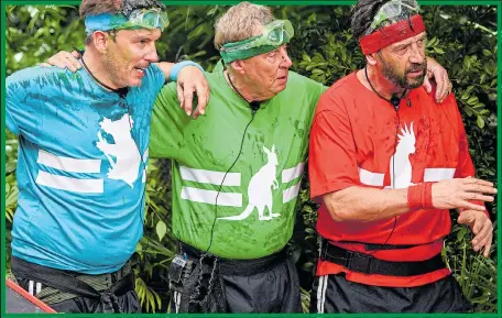  ??  ?? GOGGLES-EYED: John Barrowman, Harry Redknapp and Nick Knowles in Deadly Dash Bushtucker Trial