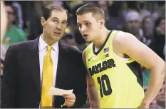  ?? Jerry Larson / Associated Press ?? Baylor head coach Scott Drew, left, speaks with Makai Mason during a recent game.