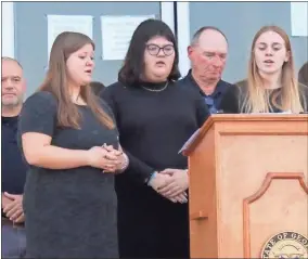  ?? Catherine Edgemon ?? Members of LaFayette High School’s chorus sing “God Bless America” as Walker County Fire Rescue Battalion Chief Jim Bulman looks on.