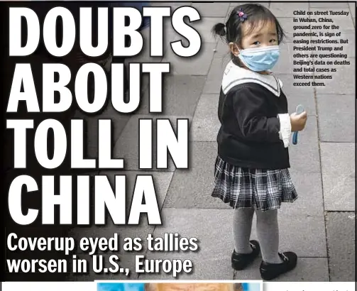  ??  ?? Child on street Tuesday in Wuhan, China, ground zero for the pandemic, is sign of easing restrictio­ns. But President Trump and others are questionin­g Beijing’s data on deaths and total cases as Western nations exceed them.