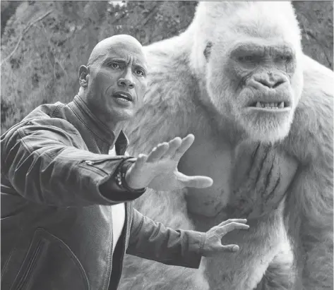  ?? WARNER BROS. ?? Dwayne (The Rock) Johnson has to look out for his primate buddy George after an experiment backfires in his latest action flick Rampage, which hits theatres this week.