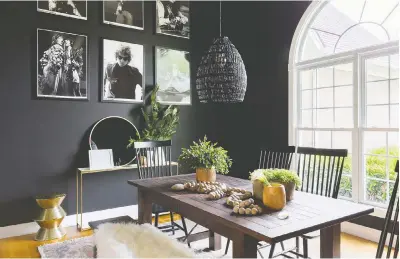  ?? ALYSSA ROSENHECK ?? “Whether sleek and modern or rustic farmhouse, black paint and decor offers a sophistica­ted air to many different looks,” says Briana Nix, designer of this dining room.