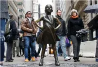  ?? — Reuters ?? The ‘Fearless Girl’ statue is seen on Broadway in the Financial District of Manhattan in New York City.