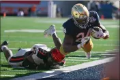  ?? SAM WASSON — GETTY IMAGES ?? Oregon State's Isaiah Chisom tackles Notre Dame running back Jadarian Price during the first half of the Sun Bowl game in El Paso, Texas on Friday.