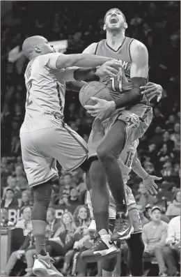  ?? Kathy Willens / The Associated Press ?? Oklahoma City center Enes Kanter (right) reacts as Brooklyn guard Randy Foye fouls him in the first half of Tuesday’s game in New York.