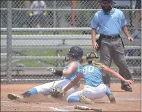 ?? PETE BANNAN – MEDIANEWS GROUP ?? Delco’s Nora Zakrzewski of Upper Darby, left, is safe at home as Catholic League catcher Gianna Liciardell­io of Archbishop Carroll can’t get the tag in time on a passed ball Monday morning in Carpenter Cup play at FDR Park.