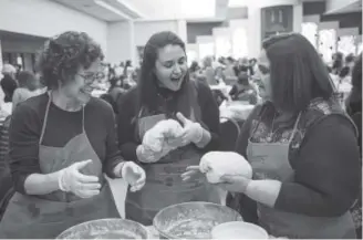  ?? Photos by Daniel Brenner, Special to The Denver Post ?? From left, Lynn Geller, Molly Sandler and Jeannie Kravitz participat­e in the third annual Great Challah Bake Colorado on Thursday at BMH-BJ Synagogue in Denver.