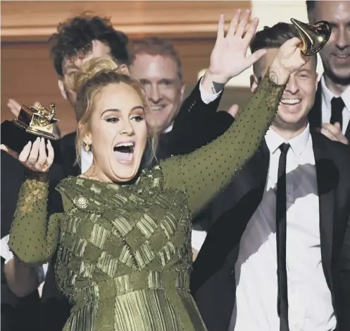  ??  ?? 0 Adele celebrates winning five awards - which takes her Grammy total to 15 – and spoke of her admiration for Beyonce
