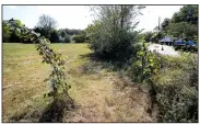  ?? NWA Democrat-Gazette/DAVID GOTTSCHALK ?? A-4.8 acre lot at 1954 S. School Avenue is visible Monday in Fayettevil­le. ServeNWA wants to build temporary emergency shelters on the property. The nonprofit is in talks with the property owner, the University of Arkansas, to buy the property.