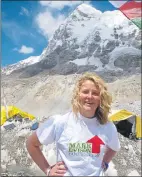  ??  ?? ADVENTURE: Ms Hughes next to Mount Everest.