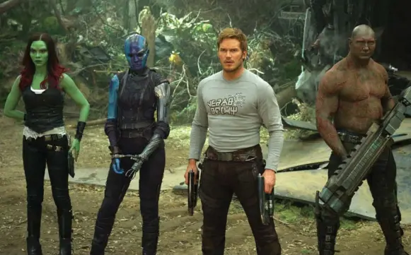  ?? DISNEY-MARVEL/THE ASSOCIATED PRESS ?? Frome left, Zoe Saldana, Karen Gillan, Chris Pratt and Dave Bautista in a scene from Guardians Of The Galaxy Vol. 2. Below, Rocket, voiced by Bradley Cooper.