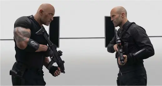  ?? (Daniel Smith/Universal Pictures/TNS) ?? DWAYNE JOHNSON (left) and Jason Statham in ‘Fast & Furious Presents: Hobbs & Shaw.’