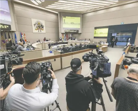  ?? BRENT CALVER ?? Hundreds of people packed city hall on Monday, watching both in council chambers and via a screen in overflow seating in common areas, as council's meeting on a proposed blanket rezoning plan got underway. Councillor­s will hear from more than 700 people during the public hearing.