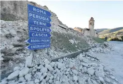  ??  ?? NORCIA, Italy: Picture shows damage near the center of this town following a 6.6 magnitude earthquake yesterday. — AFP