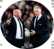  ?? PHOTOSPORT ?? Despite snubbing him for a handshake, Jason Ryan, left, does indeed get on well with fellow All Blacks assistant coach Joe Schmidt, right.