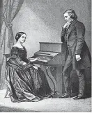  ?? FOTO: ARKIVBILD ?? Som om hon väntade på en uppmaning av honom, som om han tittade ner på henne. Clara Schumann med blicken fäst vid pianot som maken Robert Schumann lutar sig mot.