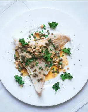  ??  ?? SKATE WITH BLACK BUTTER, PARSLEY, CAPERS, CRUSHED NUTS AND CRISPED KALE A super quick and simple supper for two which works well with mashed potato if you feel the need for carbs.
F&T WINE MATCH
Bright and intense with floral and citrus notes (eg...