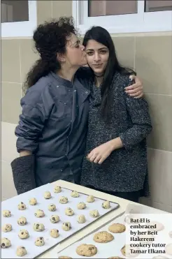  ?? PHOTOS: ROSA DOHERTY ?? Bat-El is embraced by her Beit Hakerem cookery tutor Tamar Elkana