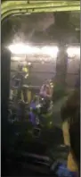  ?? JONATHAN @THISISJCAL­I —
ASSOCIATED PRESS ?? This screen shot from a cell phone video provided by Jonathan @ThisIsJCal­i from his Twitter page shows subway passengers being evacuated, as seen from a D train stuck on the tracks as it was headed to the 125th street station.