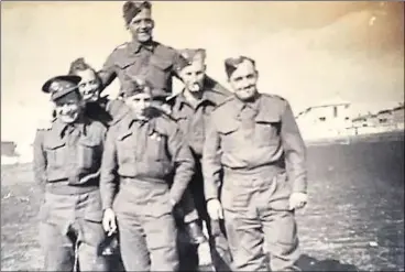  ??  ?? Another picture taken during the war, with Stan pictured in the middle row on the left