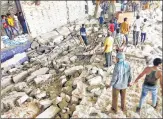  ?? PTI ?? Rescue operation underway after a wall collapsed at a factory in Halvad GIDC area, in Morbi district on Wednesday.