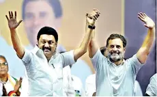  ?? ?? Indian National Congress party leader Rahul Gandhi (R) and Tamil Nadu's Chief Minister M.K Stalin gesture at a public meeting in Coimbatore on April 12, 2024 (Photo by R.Satish Babu/AFP)