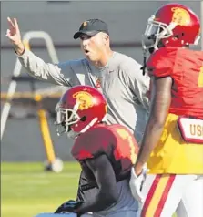  ?? Al Seib Los Angeles Times ?? CLAY HELTON oversees USC practice in his role as interim football coach in the wake of Steve Sarkisian’s dismissal.