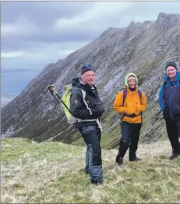  ?? 01_B21mountai­n12 ?? Above: Leader Alastair Howe, left, with walkers and Coire nam Fuaran behind them.