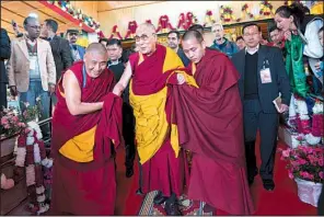  ?? AP/TENZIN CHOEJOR ?? The Dalai Lama prepares to address followers Saturday in Tawang, India. His visit to India’s Arunachal Pradesh state has drawn protests from China, which claims part of the state as its territory.