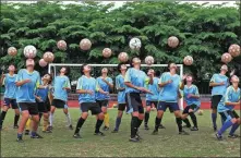  ?? WANG WENYANG / FOR CHINA DAILY ?? The women’s football team in Qiongzhong Li and Miao autonomous county, Hainan province, train on April 24, 2013. The amateur team won three championsh­ips in the World Youth Gothia Cup. The county got rid of poverty in 2019.