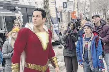  ?? Steve Wilkie / Warner Bros. Entertainm­ent via AP ?? Zachary Levi, left, and Jack Dylan Grazer star in the latest DC Comics movie, “Shazam!” The superhero flick with a bad guy from upstate New York led the way at the box office this weekend.