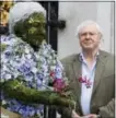  ?? AP FILE PHOTO — KIRSTY WIGGLESWOR­TH ?? In this May 17, 2012 file photo, British television personalit­y Sir David Attenborou­gh stands with a floral sculpture of himself at Kew Gardens in London.