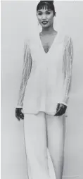  ?? Supplied ?? A white tulle beaded jacket with palazzo pants offered coverage in the miniskirt era.